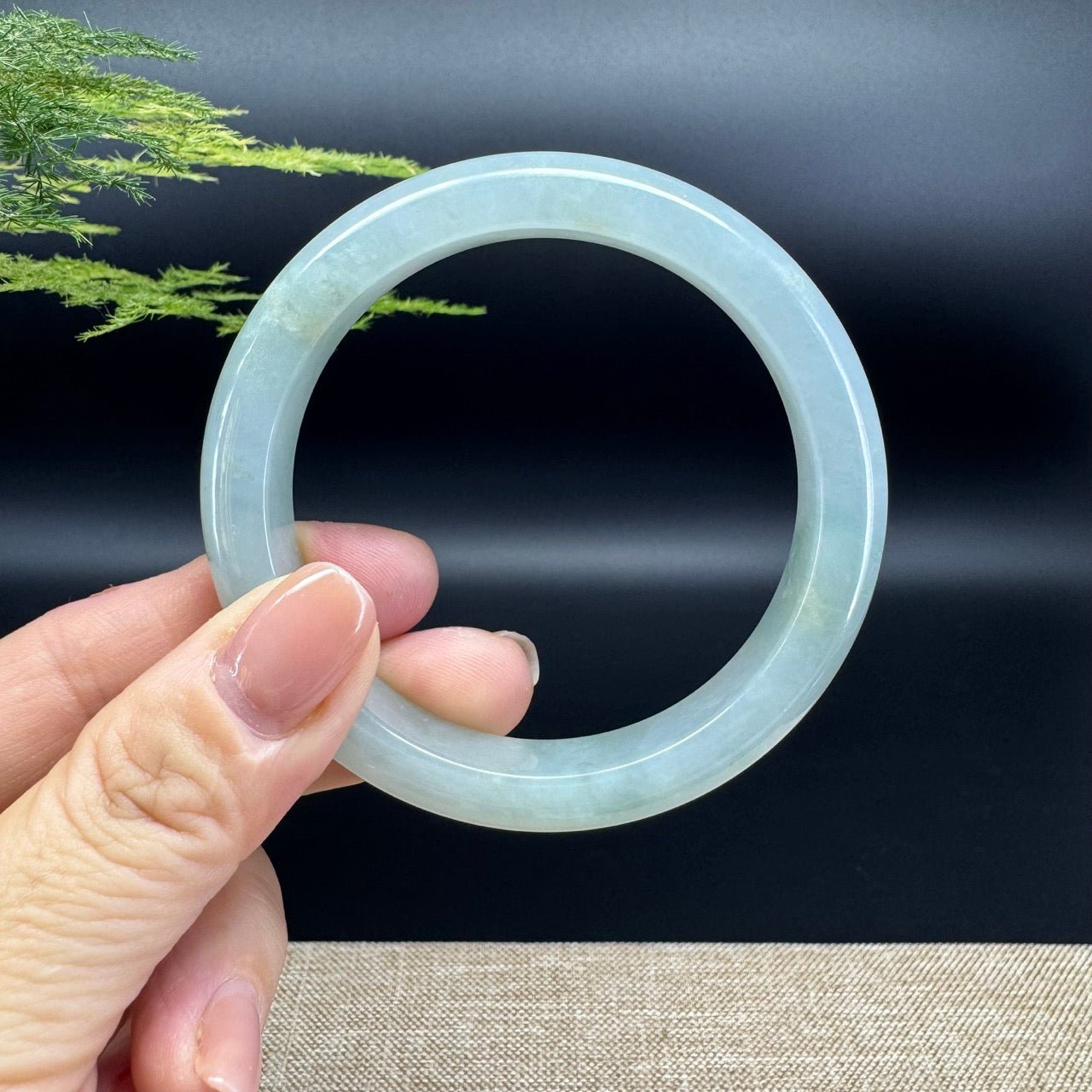 The bangle shape of the half round.The bangle color is icy green.