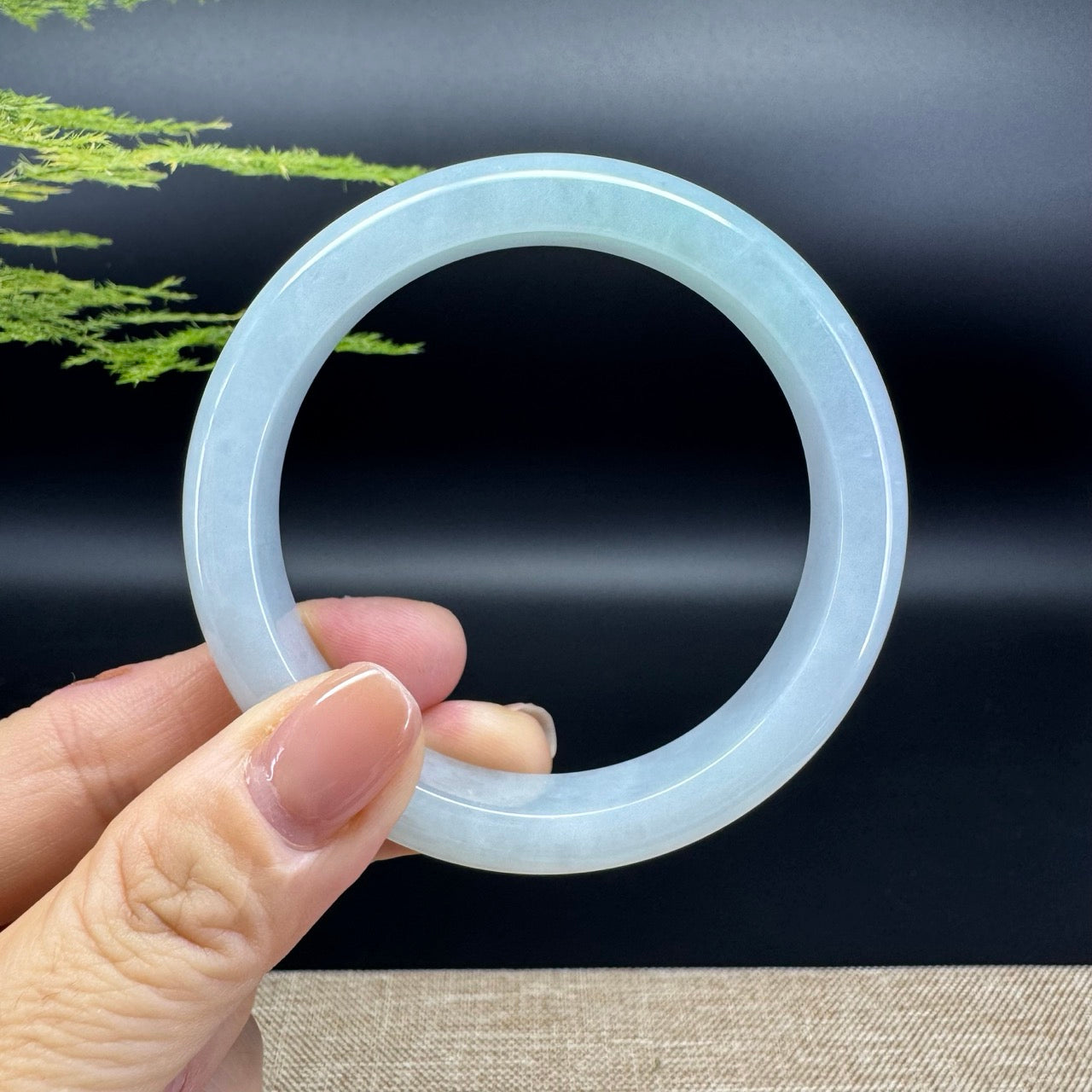 The bangle shape of the half round.The bangle color is icy green.