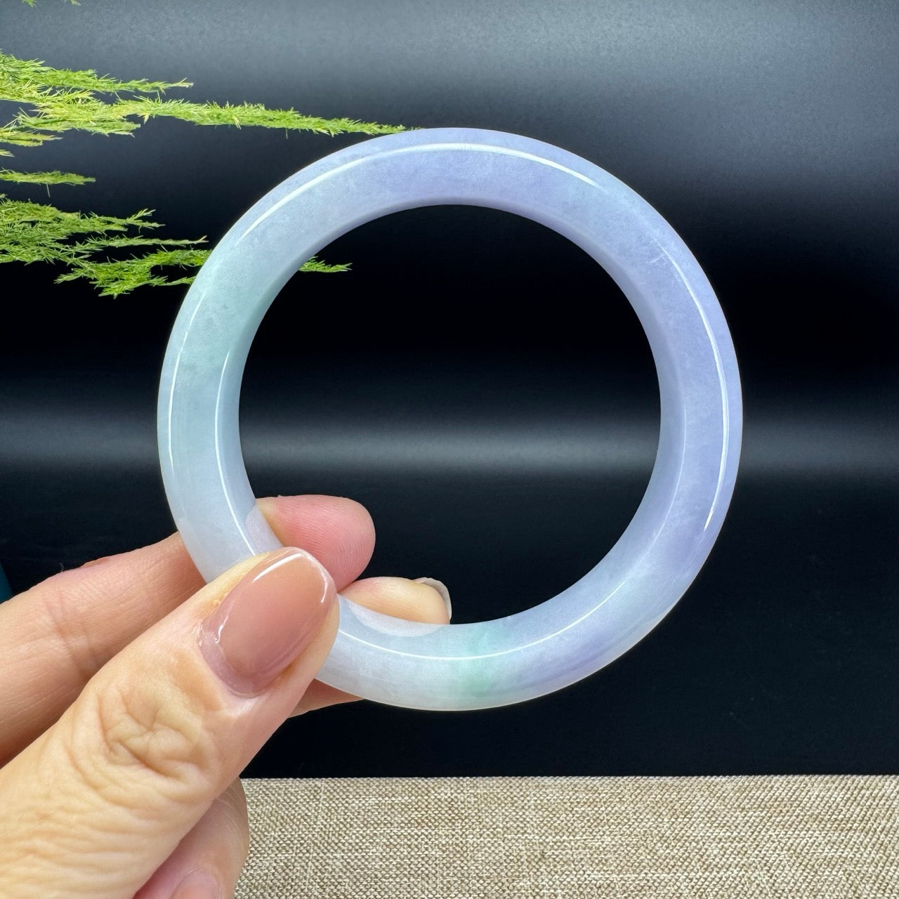 The bangle shape of the half round.The bangle color is lavender green.