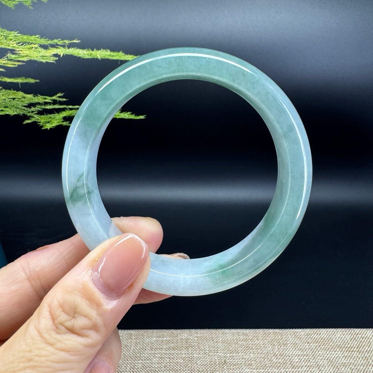 The bangle shape of the half round.The bangle color is icy green.