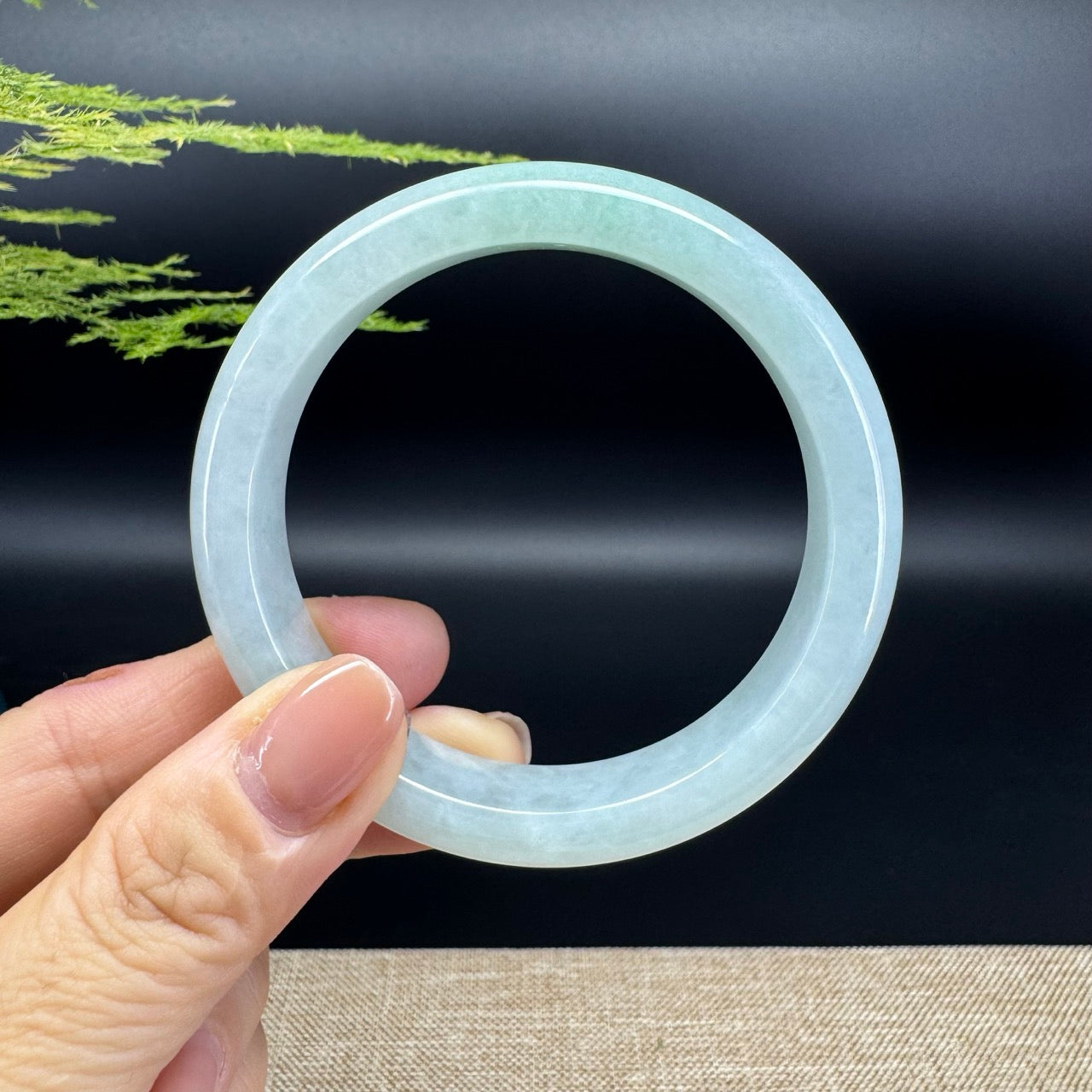 The bangle shape of the half round.The bangle color is icy green.