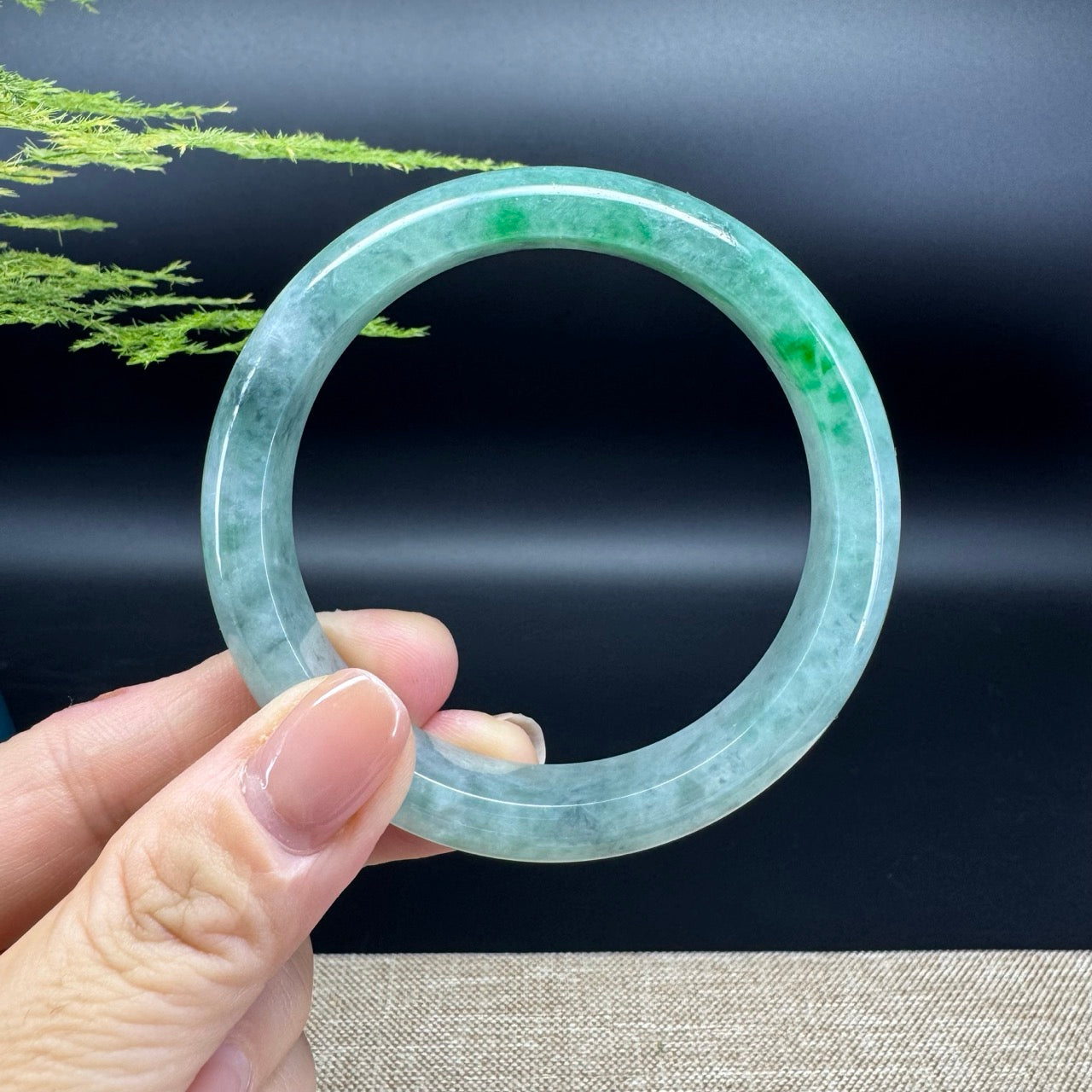 The bangle shape of the half round.The bangle color is blue green.