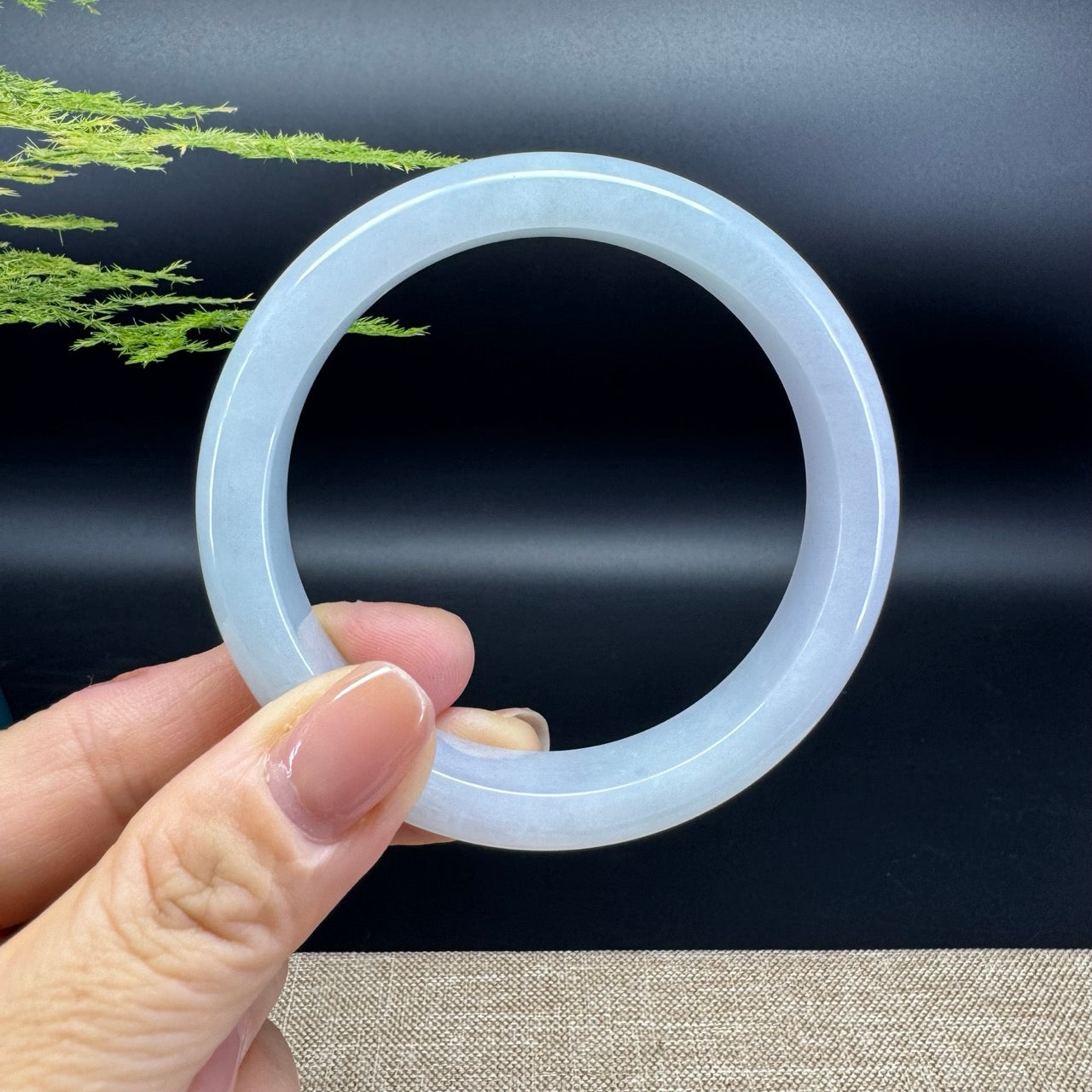 The bangle shape of the half round.The bangle color is lavender green.