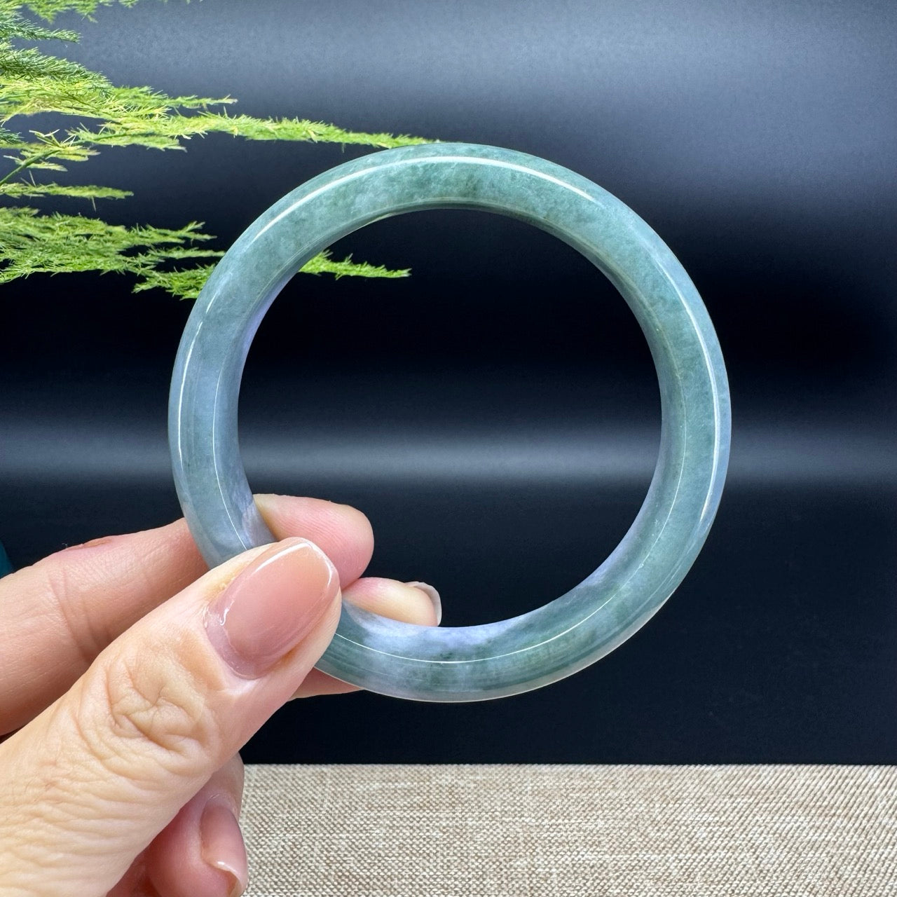 The bangle shape of the half round.The bangle color is lavender green.
