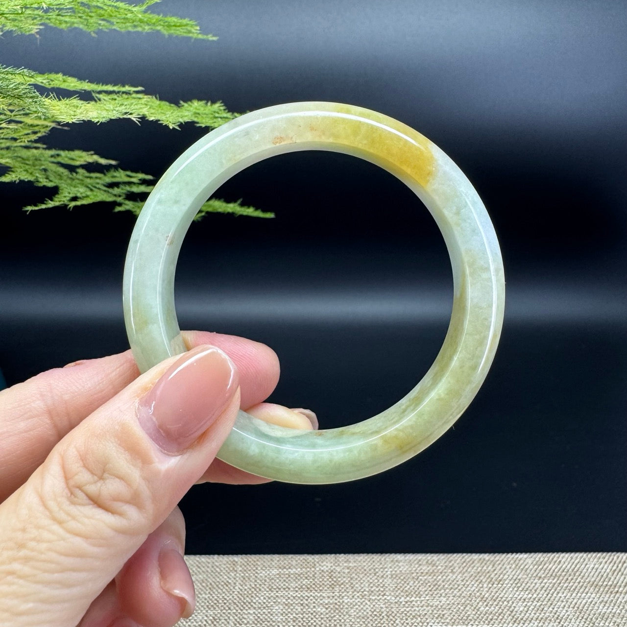 The bangle shape of the half round.The bangle color is yellow green.