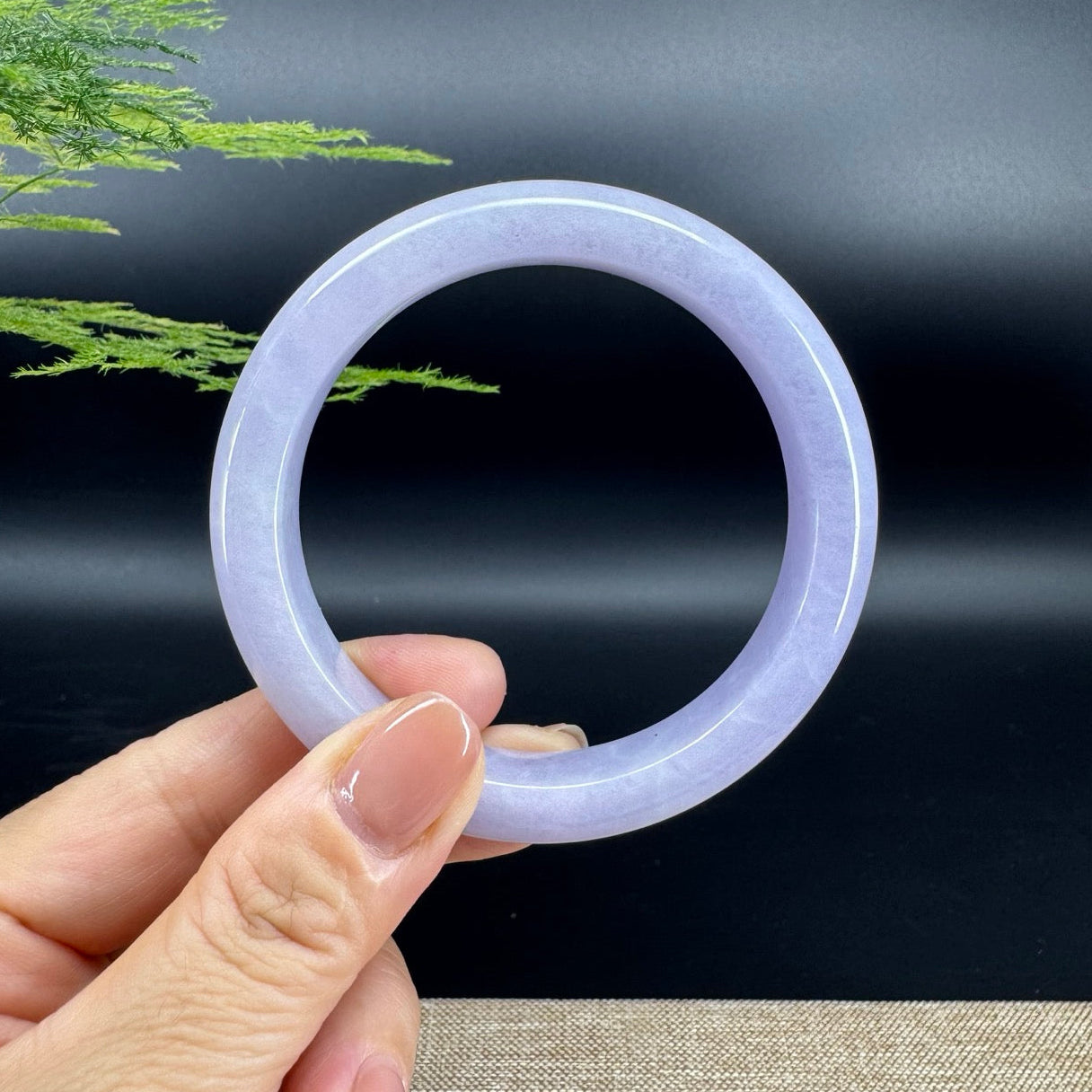 The bangle shape of the half round.The bangle color is lavender.