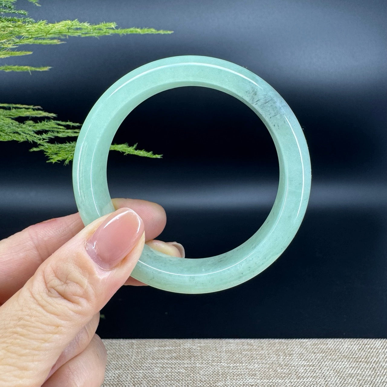 The bangle shape of the half round.The bangle color is apple green and some wuji.
