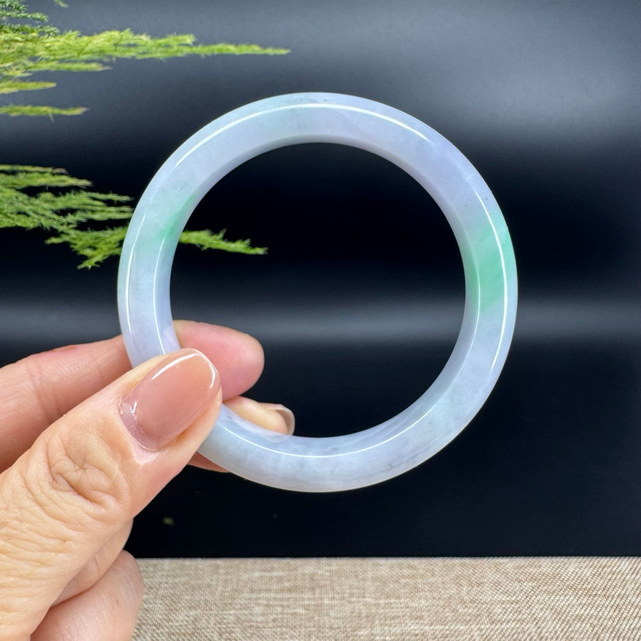 The bangle shape of the half round.The bangle color is lavender green.