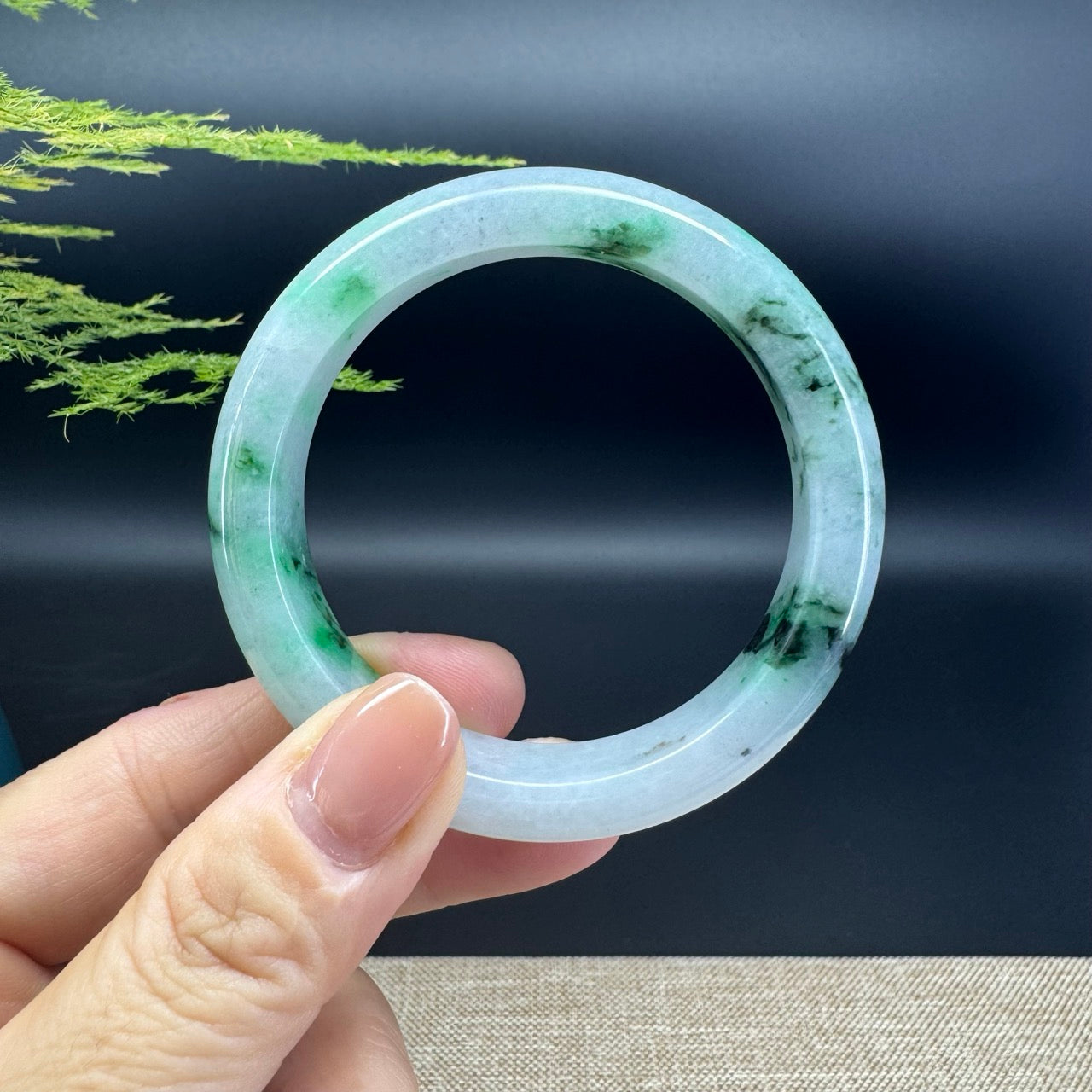 The bangle shape of the half round.The bangle color is icy blue green flower.