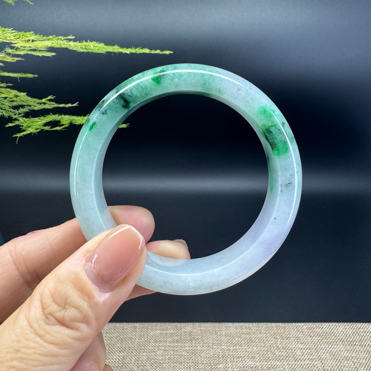 The bangle shape of the half round.The bangle color is lavender green. 