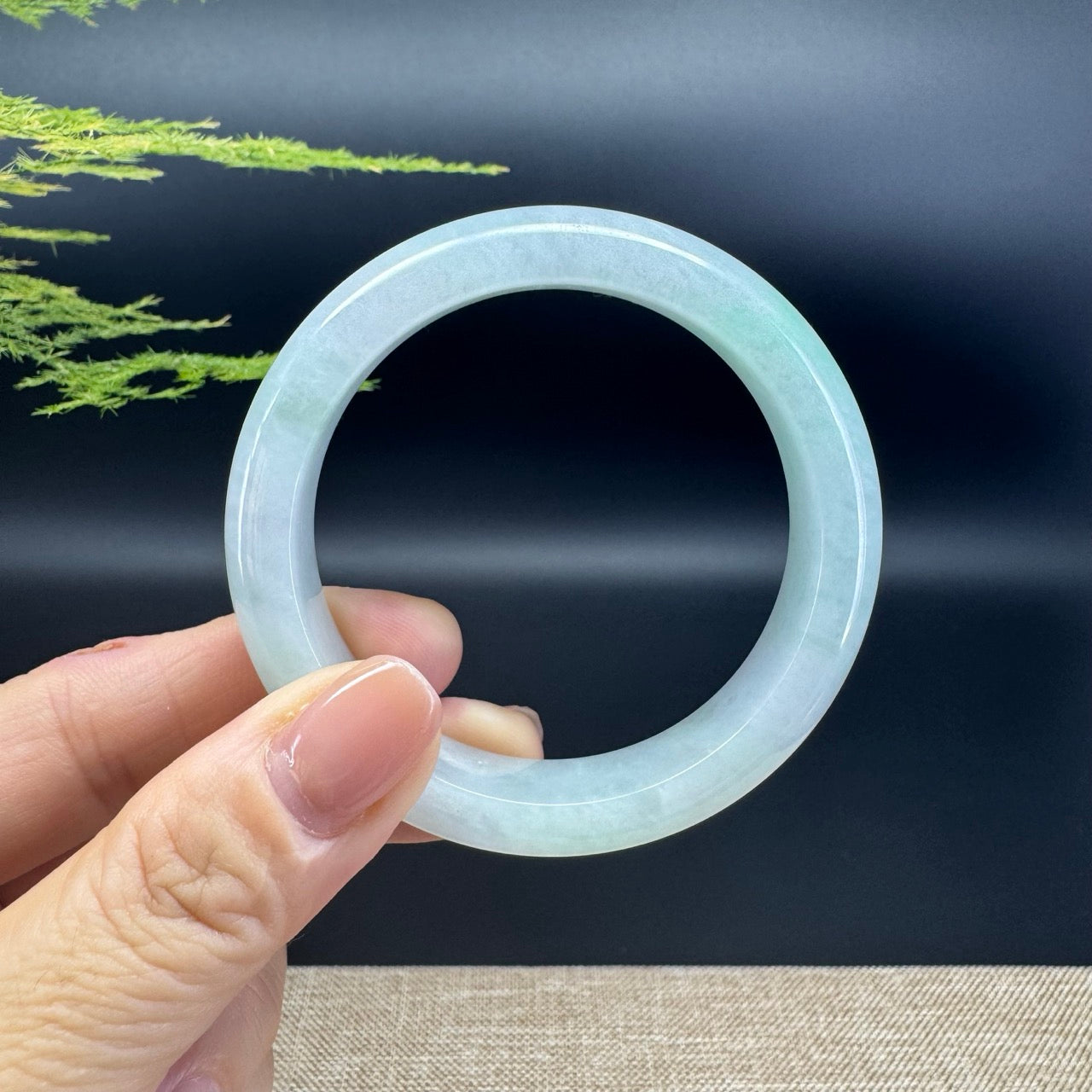 The bangle shape of the half round.The bangle color is icy green.