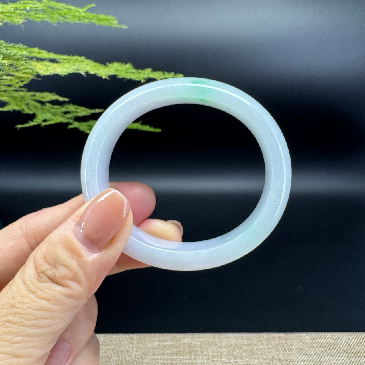 The bangle shape of the half round.The bangle color is icy green.