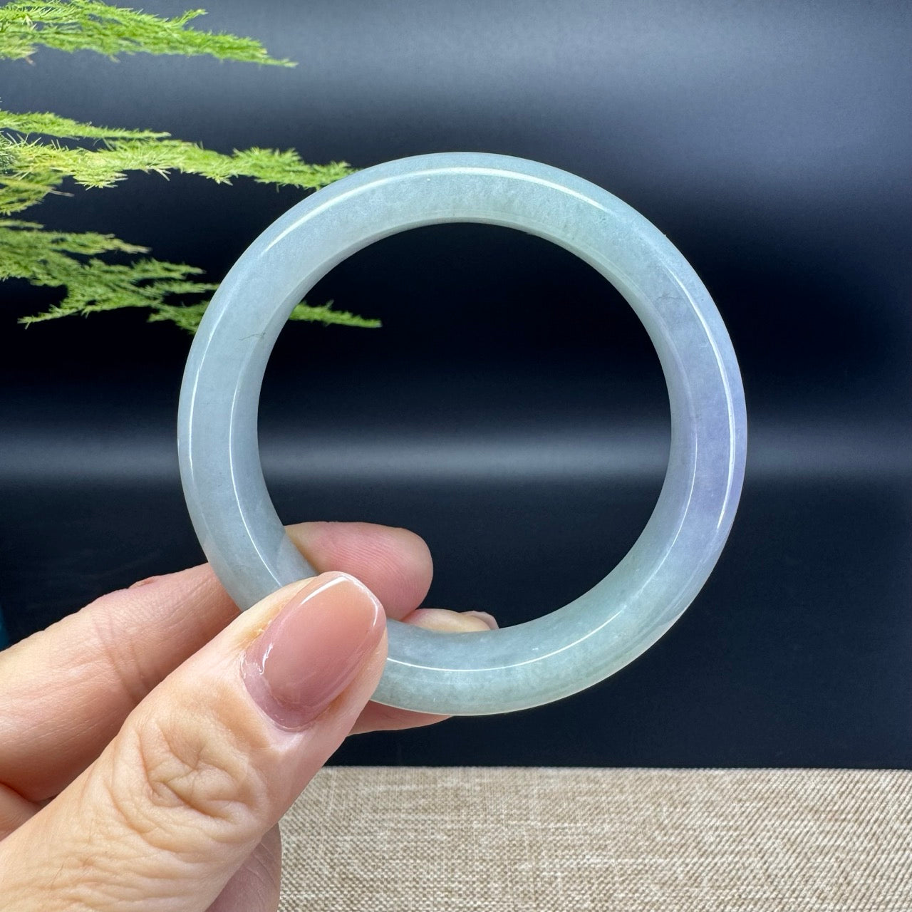 The bangle shape of the half round.The bangle color is lavender green.