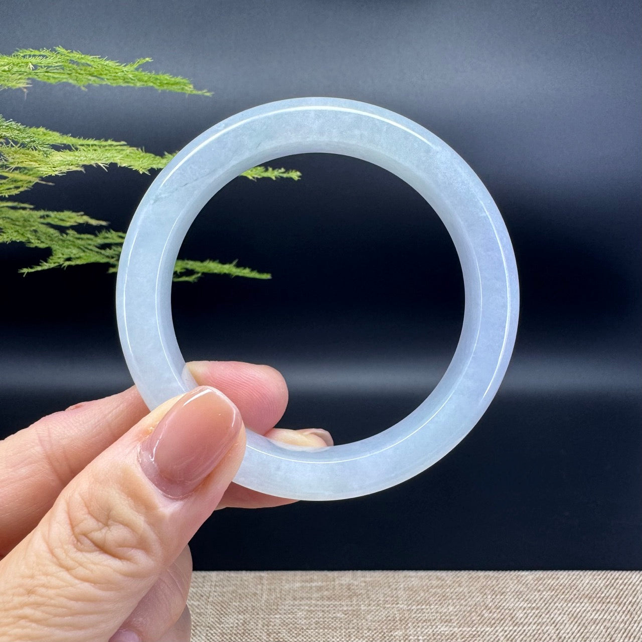 The bangle shape of the half round.The bangle color is lavender.