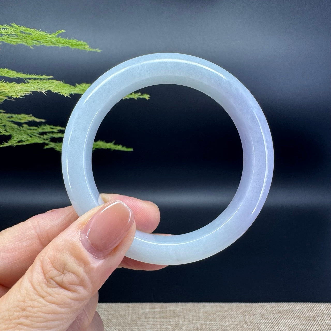 The bangle shape of the half round.The bangle color is lavender.