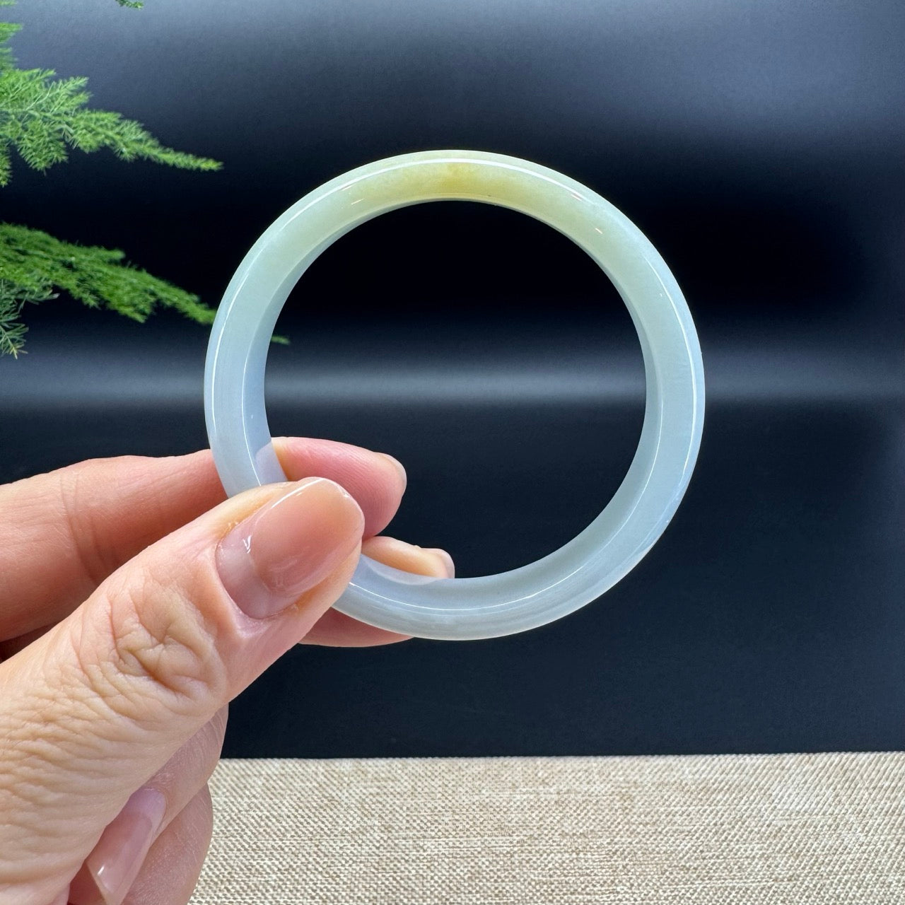 The bangle shape of the half round.The bangle color is yellow green.