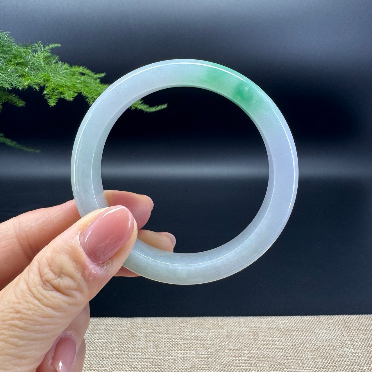 The bangle shape of the half round.The bangle color is icy lavender green.