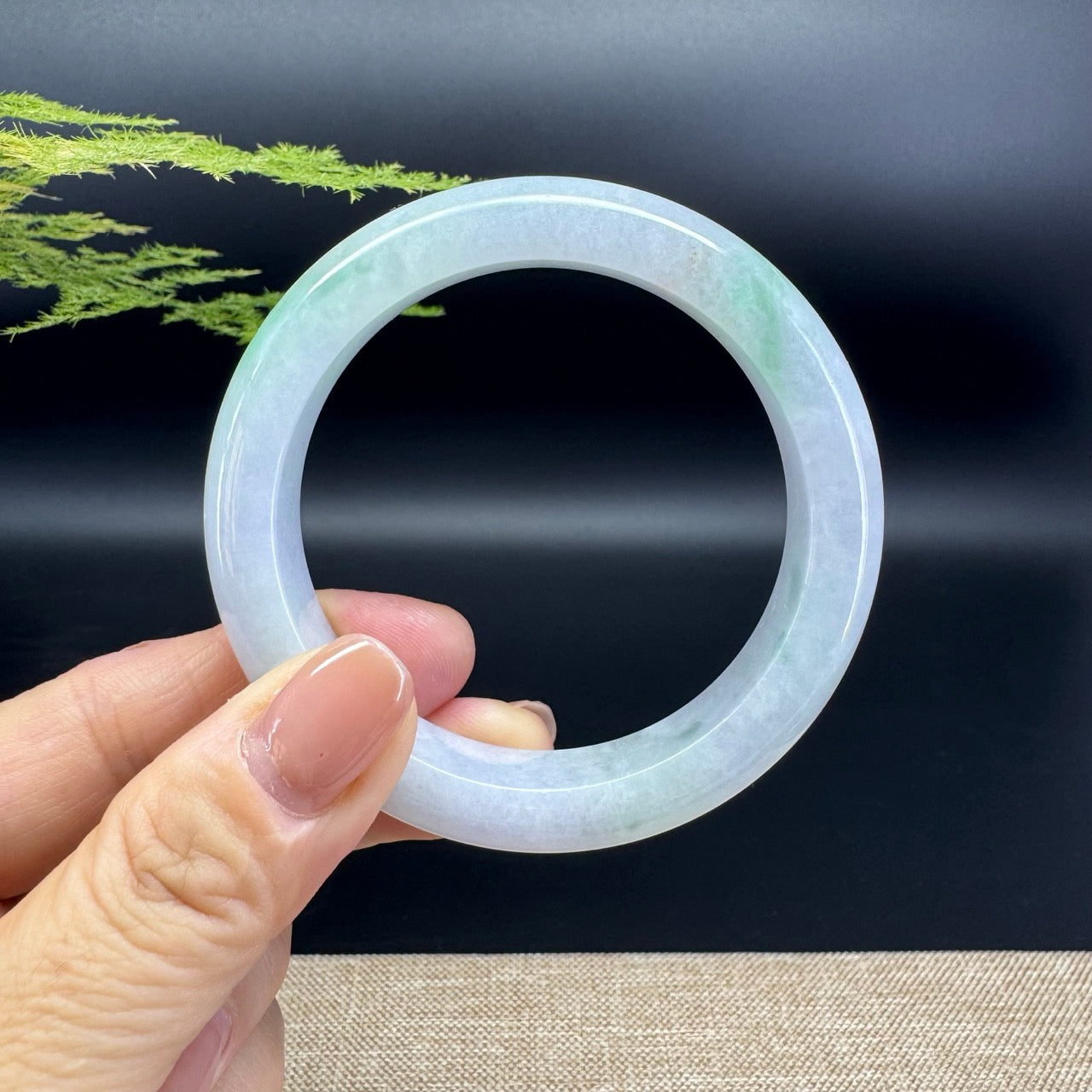 The bangle shape of the half round.The bangle color is icy lavender green.