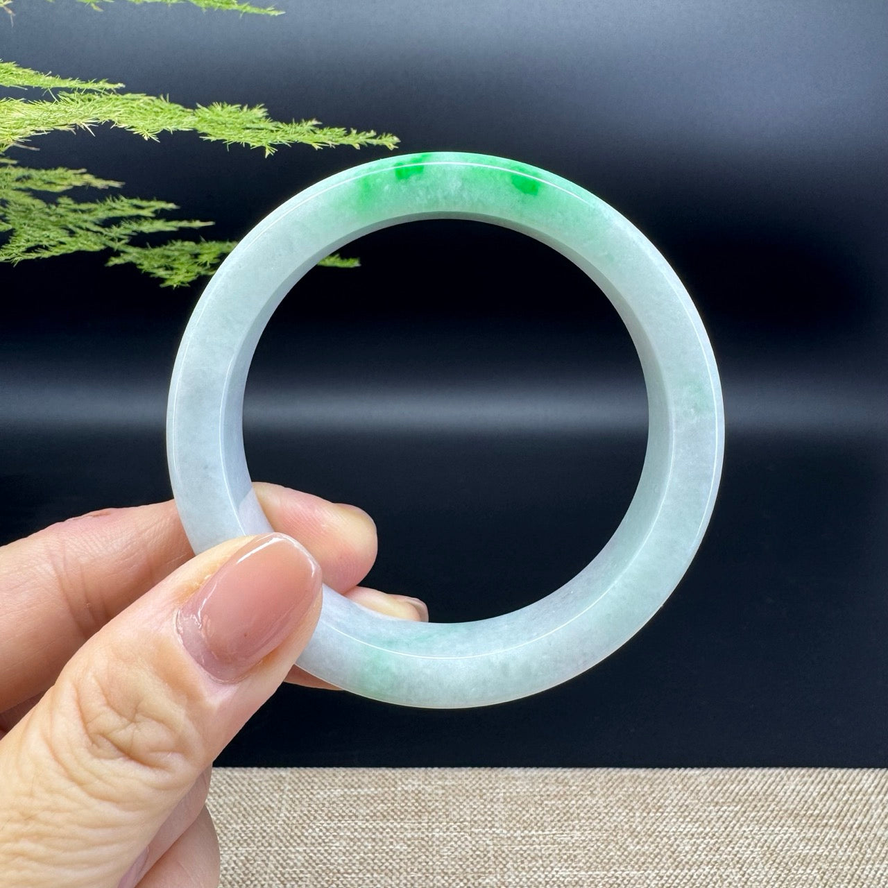 The bangle shape of the half round.The bangle color is icy green.