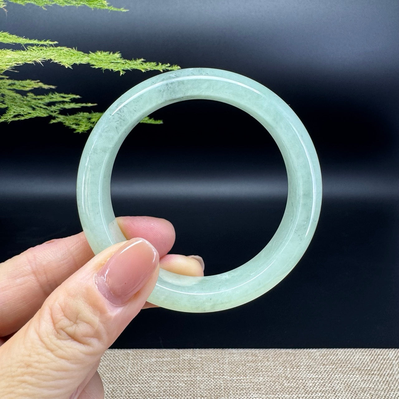 The bangle shape of the half round.The bangle color is light green.