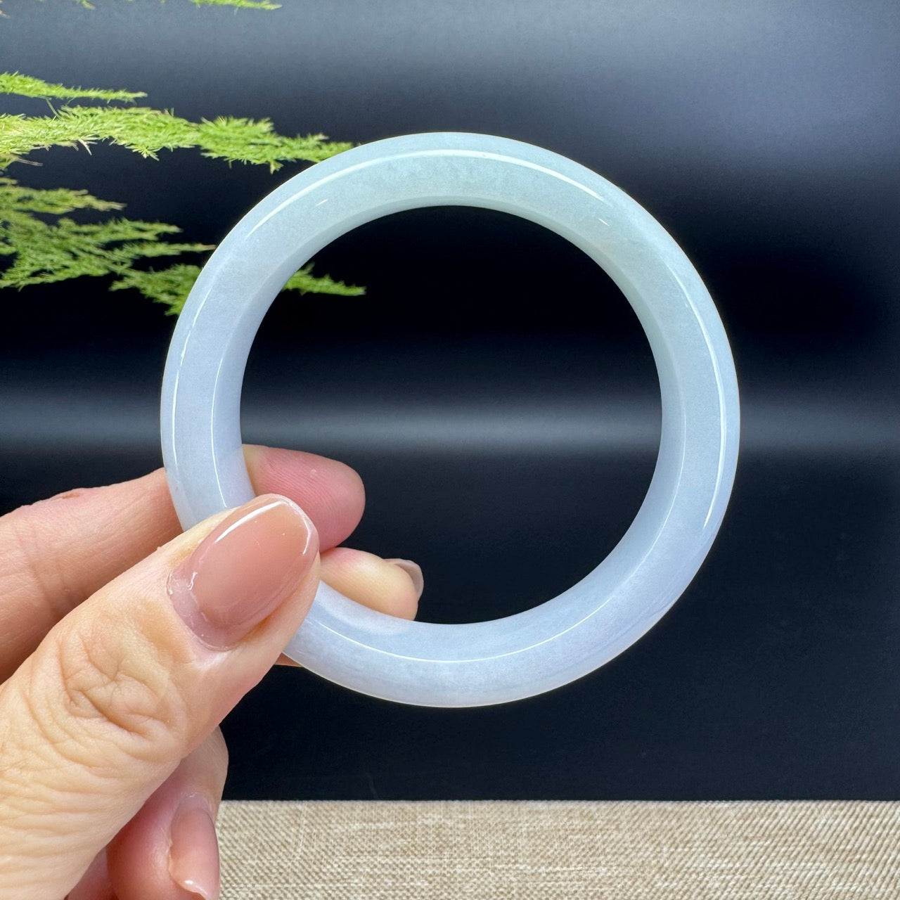 The bangle shape of the half round.The bangle color is icy lavender green.