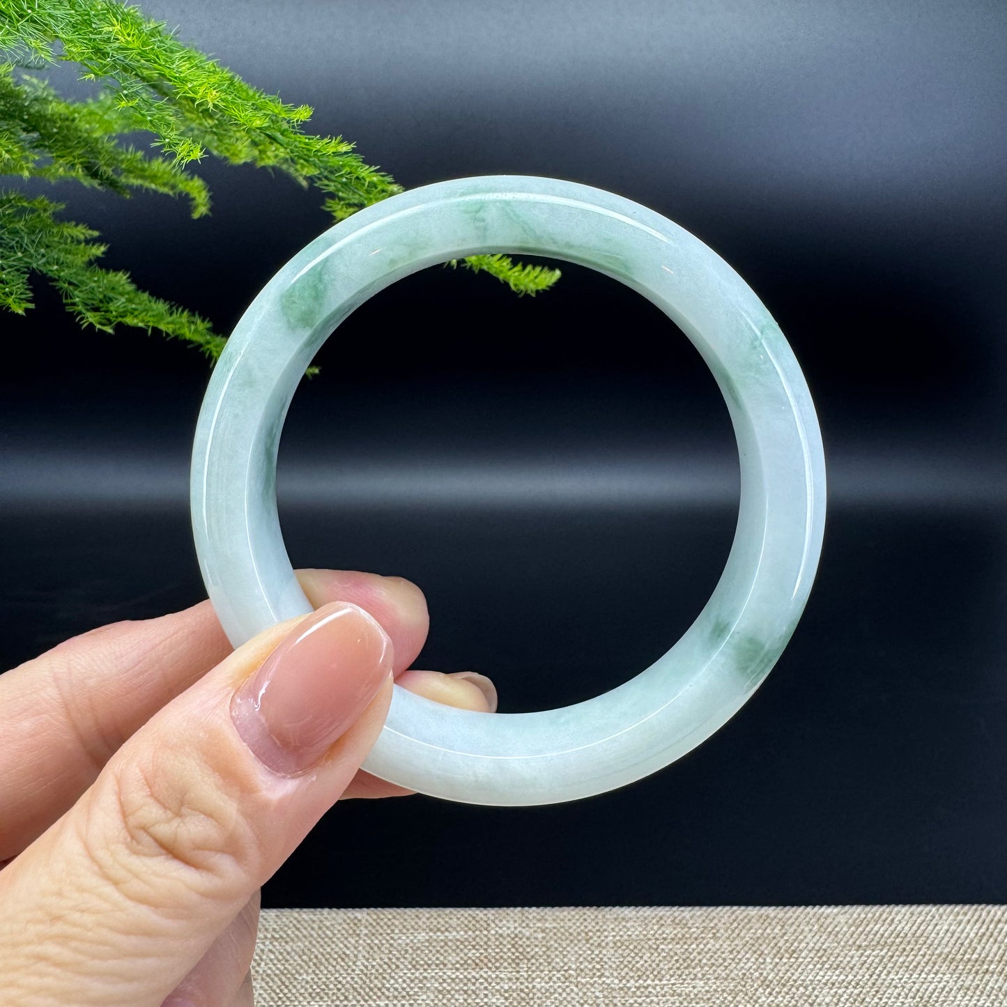 The bangle shape of the half round.The bangle color is icy green.