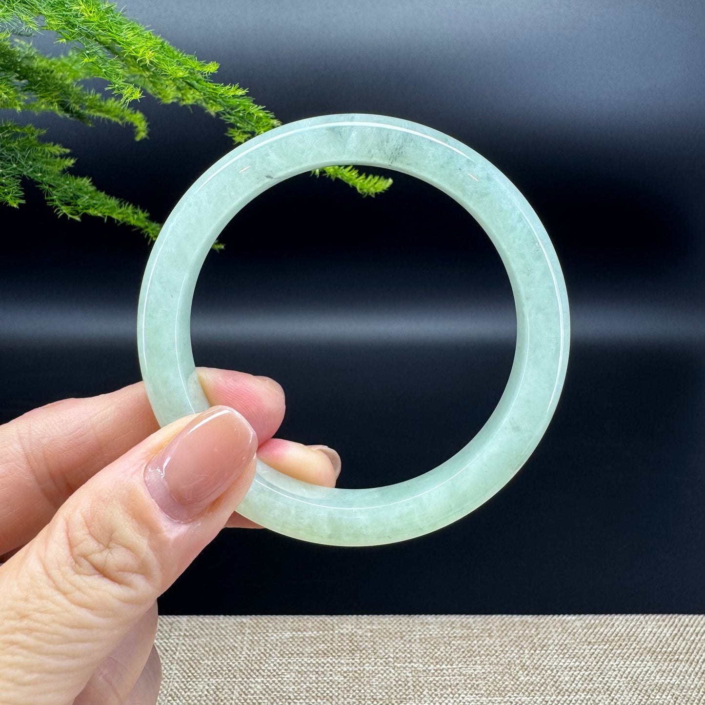 The bangle shape of the half round.The bangle color is light green.