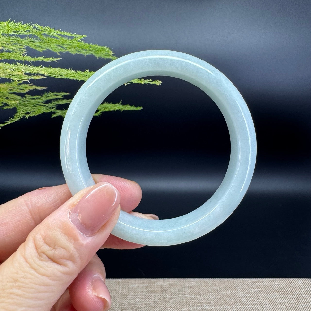 The bangle shape of the half round.The bangle color is green.