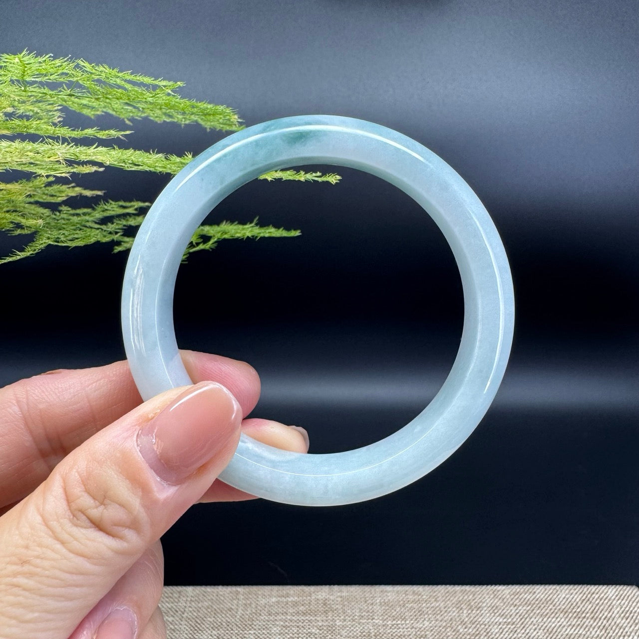 The bangle shape of the half round.The bangle color is icy green.