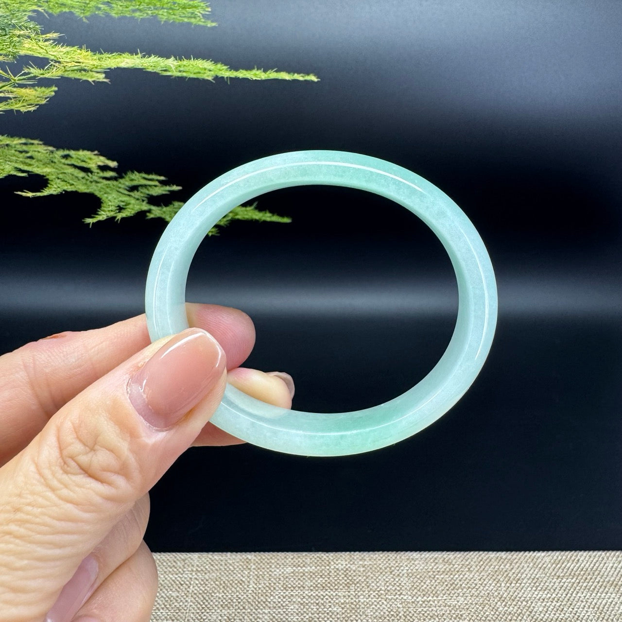 The bangle shape of the half round.The bangle color is green.