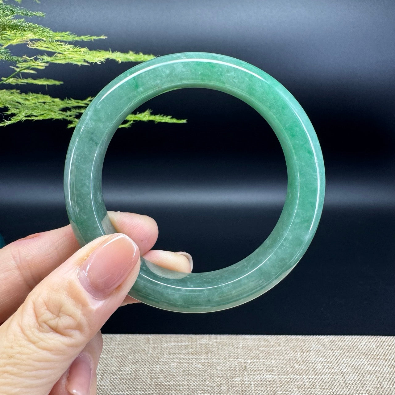 The bangle shape of the half round.The bangle color is forest green.
