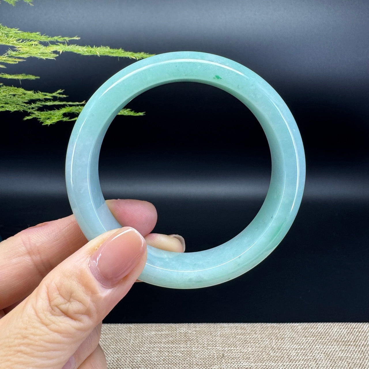 The bangle shape of the half round.The bangle color is icy green.