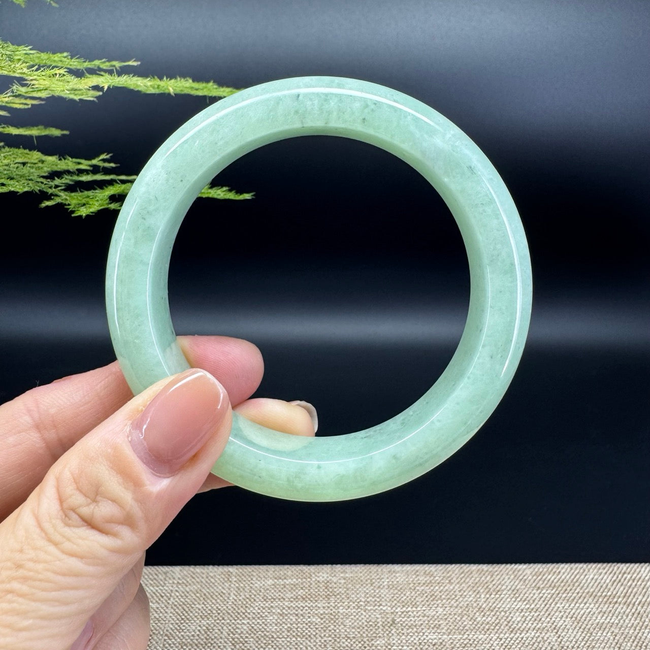 The bangle shape of the half round.The bangle color is apple green and some wuji.