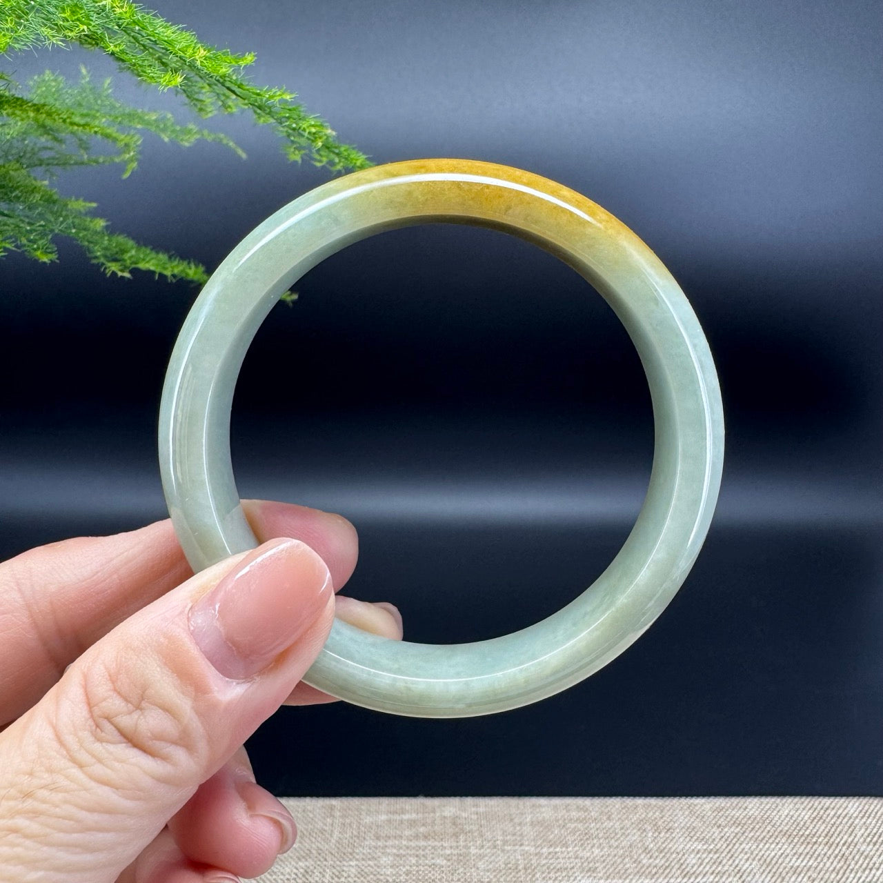 The bangle shape of the half round.The bangle color is yellow green.