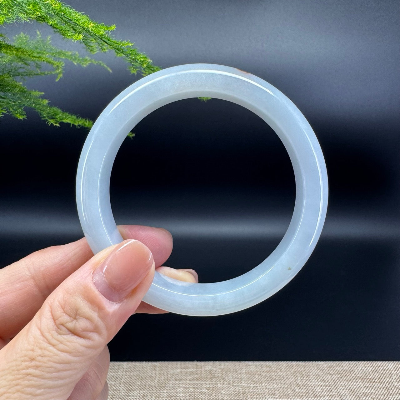 The bangle shape of the half round.The bangle color is green.