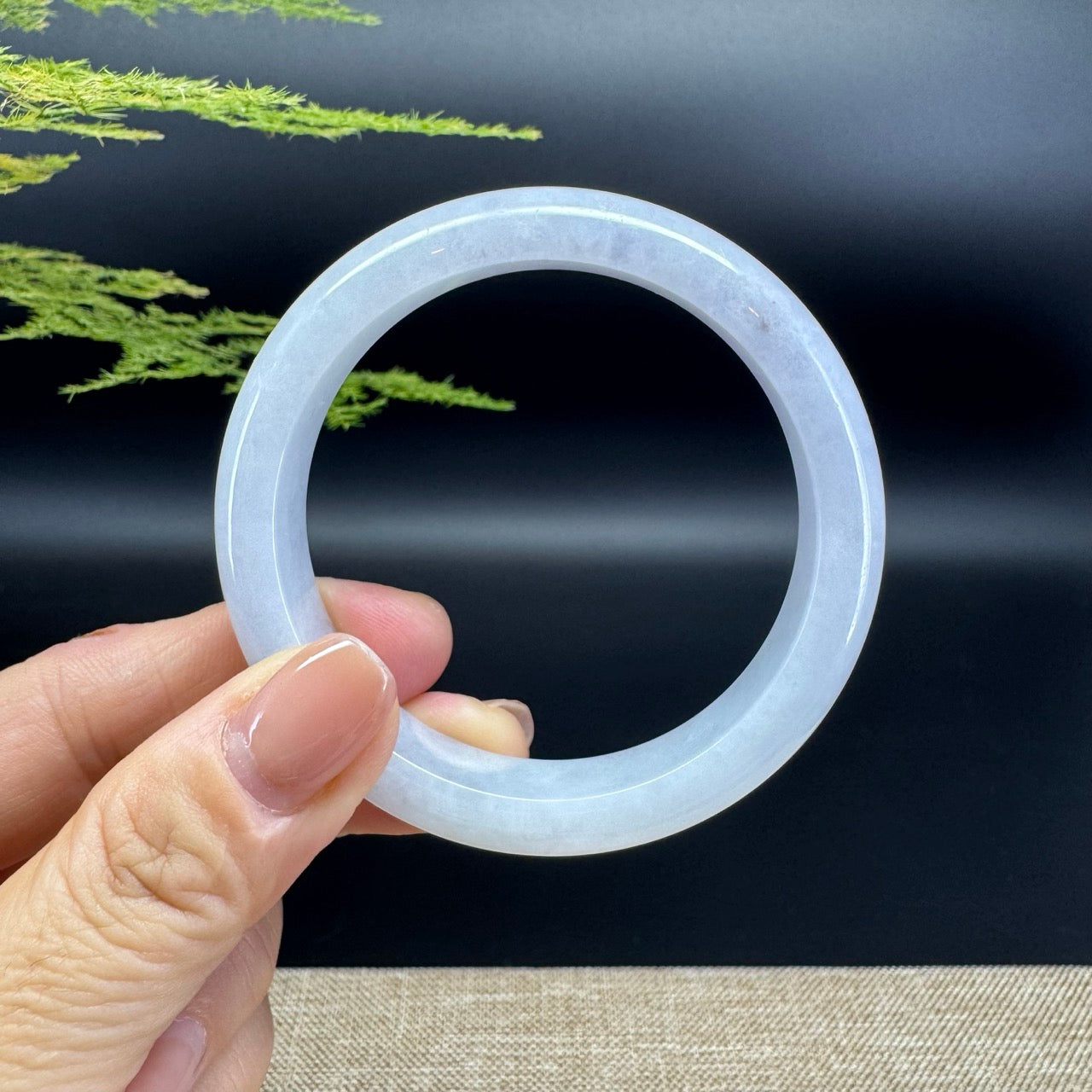 The bangle shape of the half round.The bangle color is icy.