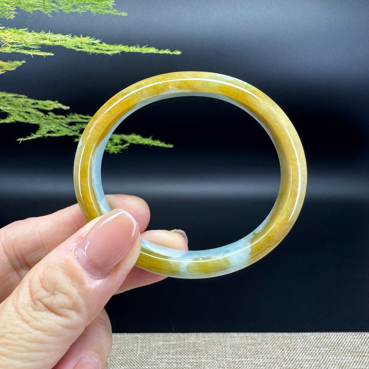 The bangle shape of the half round.The bangle color is yellow green.