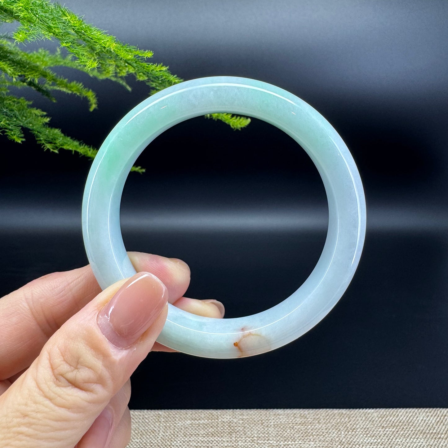 The bangle shape of the half round.The bangle color is lavender green.