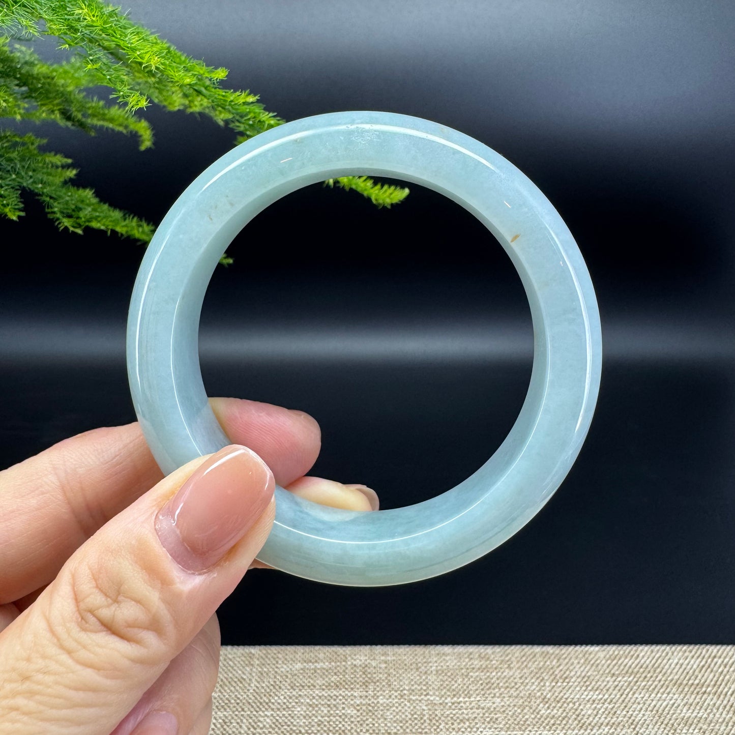 The bangle shape of the half round.The bangle color is green.