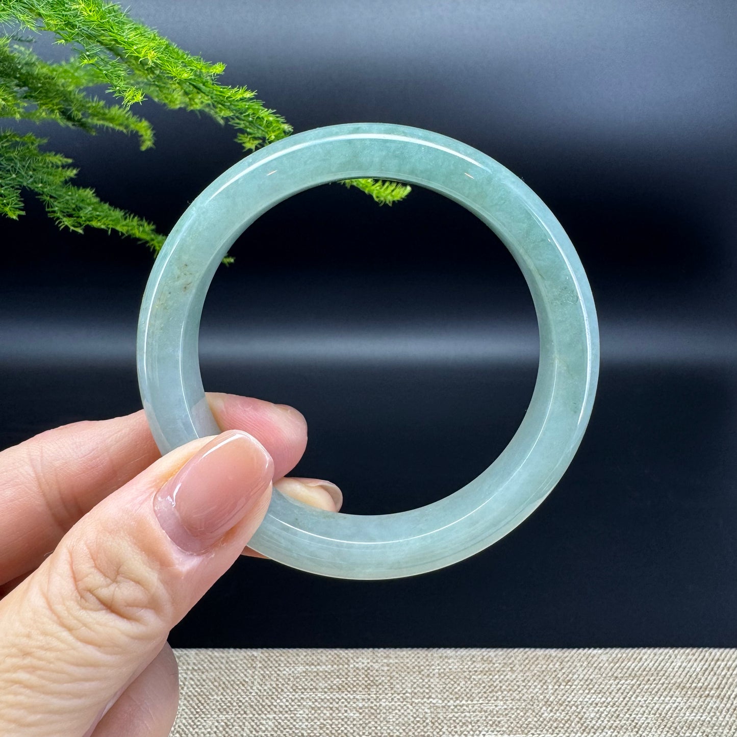 The bangle shape of the half round.The bangle color is icy green.