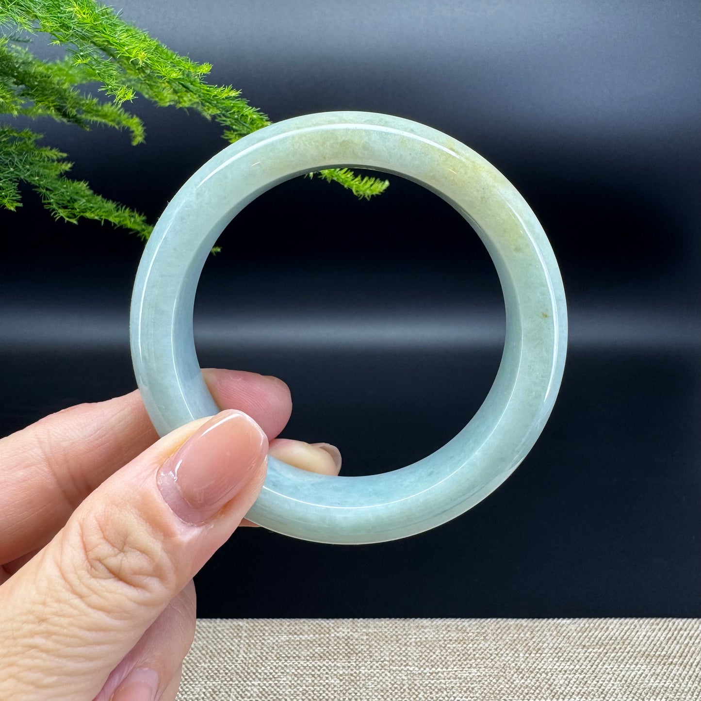 The bangle shape of the half round.The bangle color is yellow green.