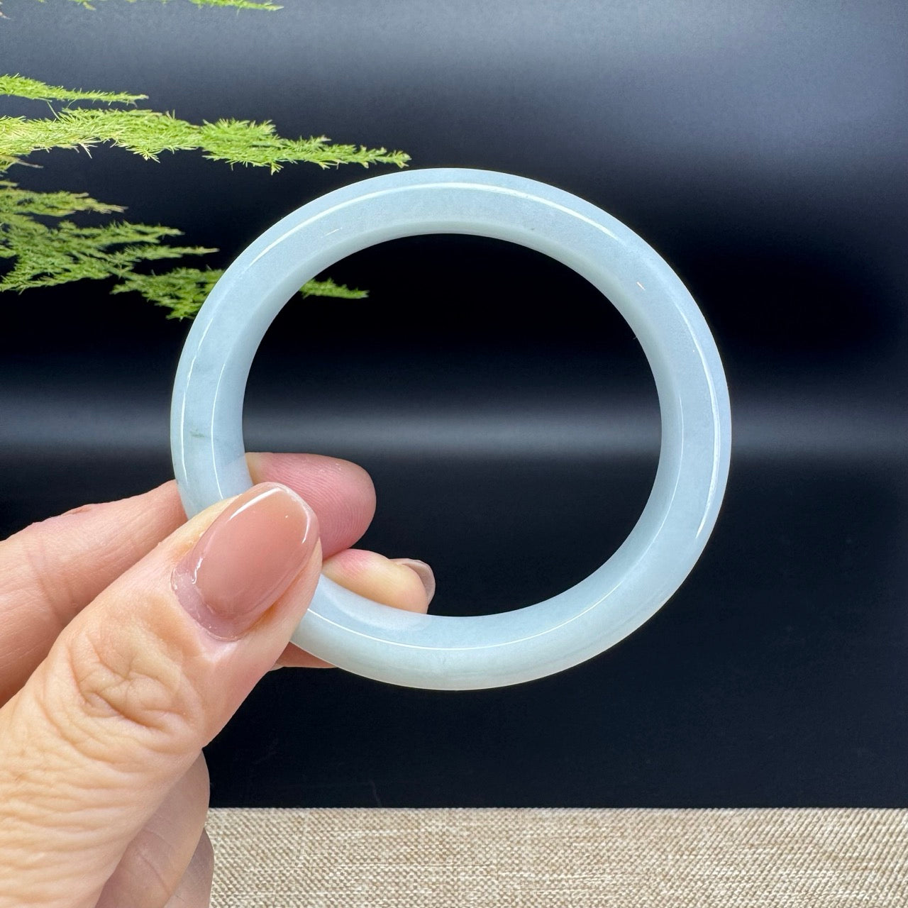 The bangle shape of the half round.The bangle color is icy green.