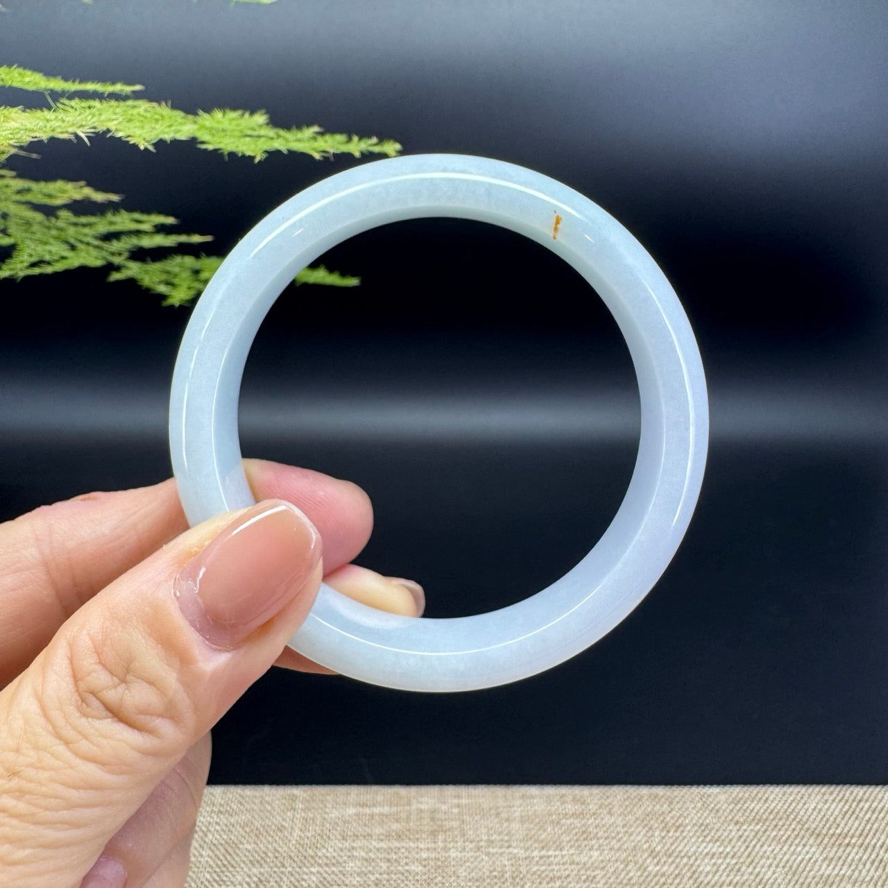 The bangle shape of the half round.The bangle color is icy green.