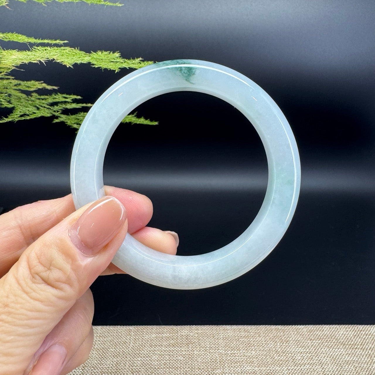 The bangle shape of the half round.The bangle color is icy green.