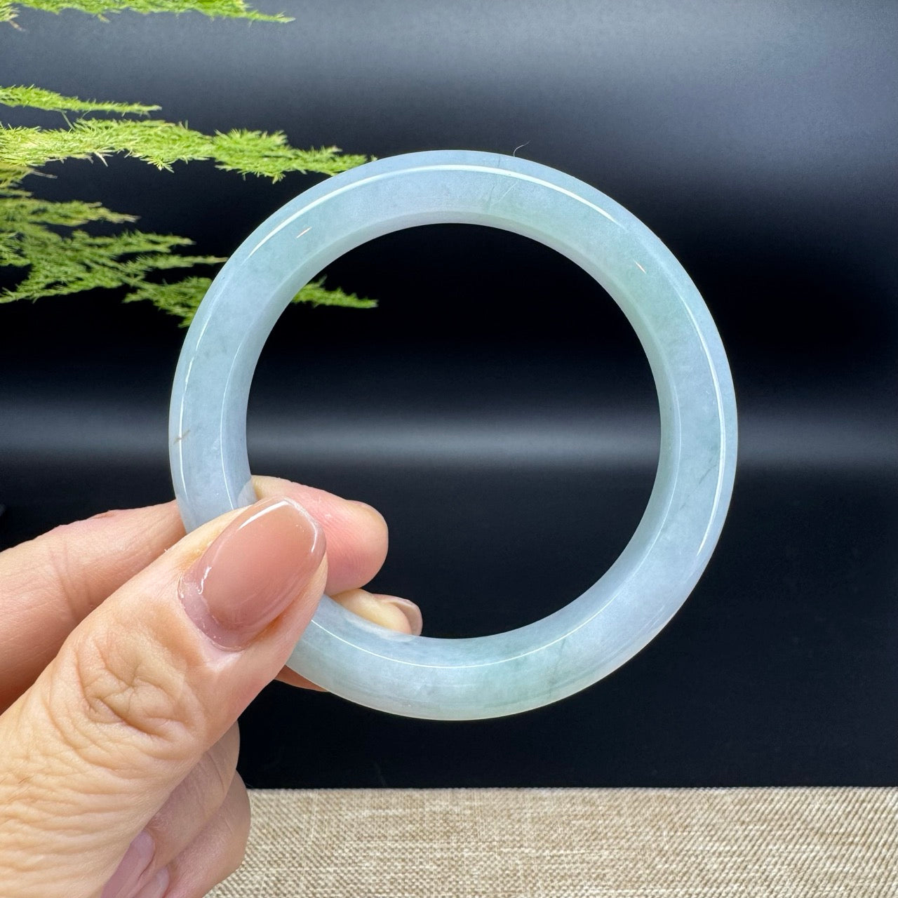 The bangle shape of the half round.The bangle color is icy green.