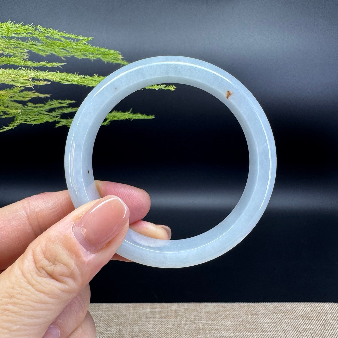 The bangle shape of the half round.The bangle color is icy green.