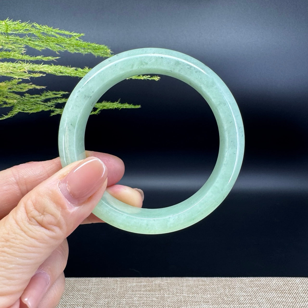 The bangle shape of the half round.The bangle color is apple green.