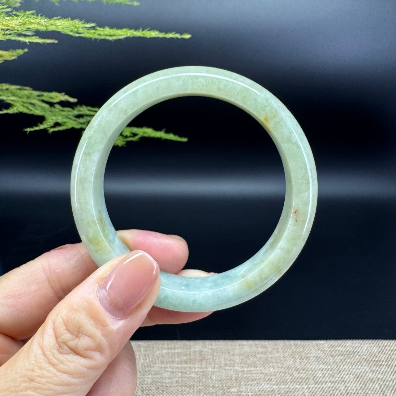 The bangle shape of the half round.The bangle color is yellow green.