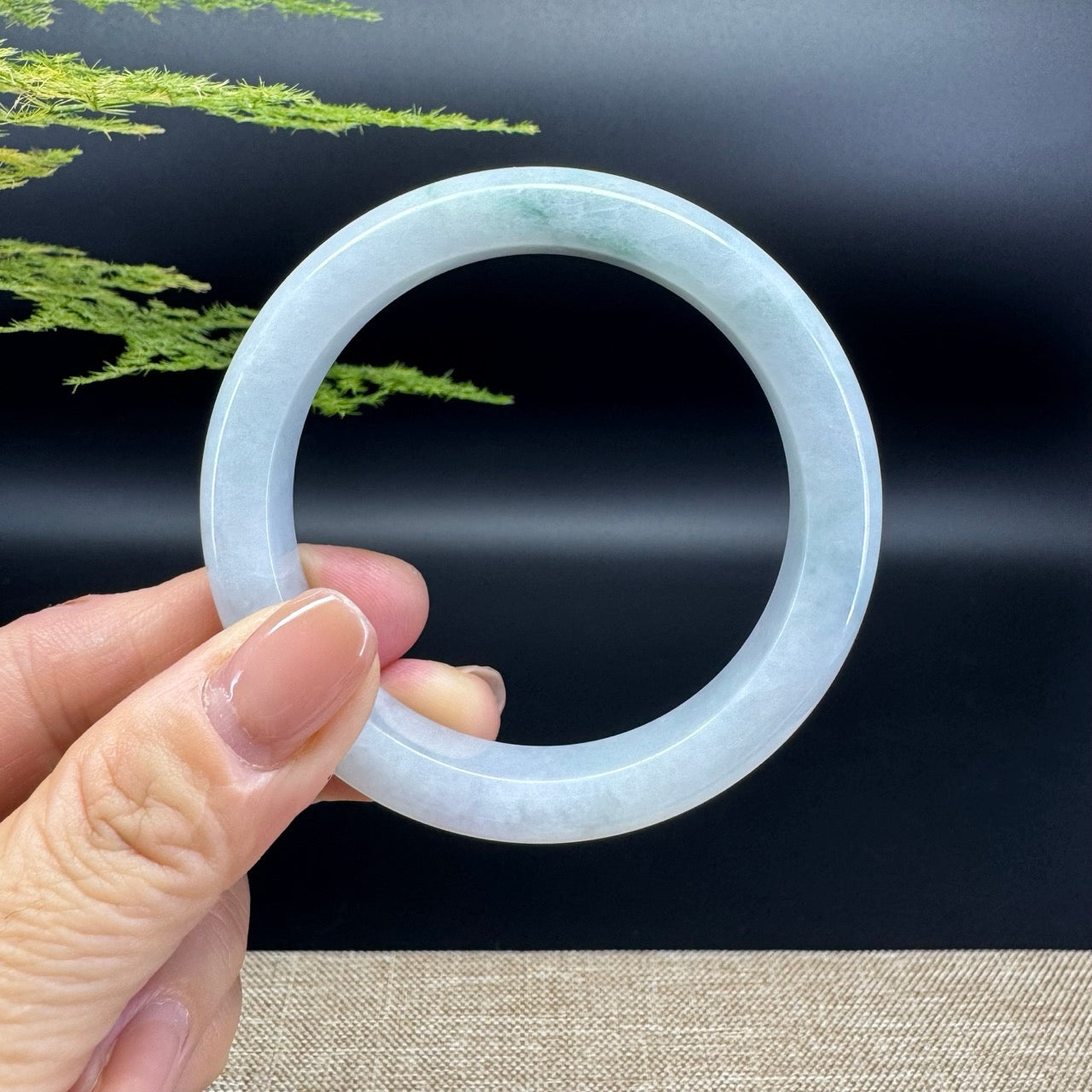 The bangle shape of the half round.The bangle color is icy green.