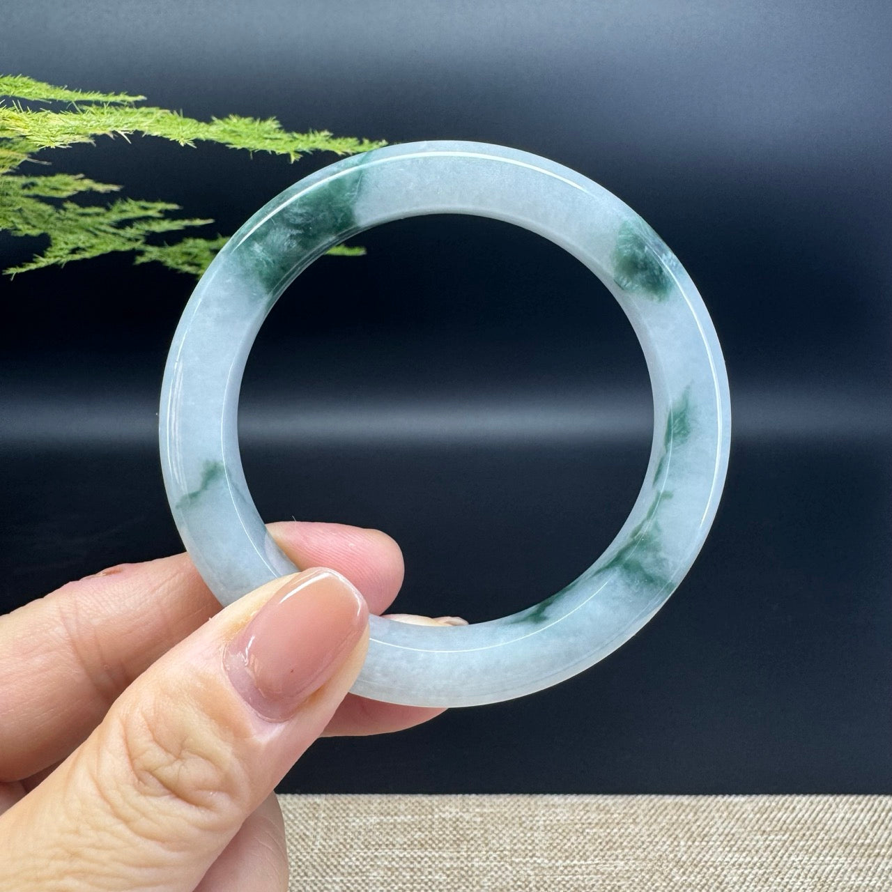 The bangle shape of the half round.The bangle color is icy green.